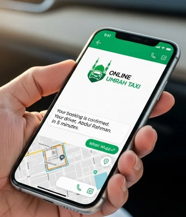 Close-up of pilgrim hand holding smartphone showing WhatsApp chat with Online Umrah Taxi logo, blurred car interior background
