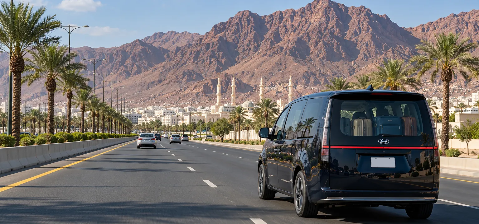 Jeddah Airport to Madinah taxi: a Hyundai Staria on the highway approaching Madinah
