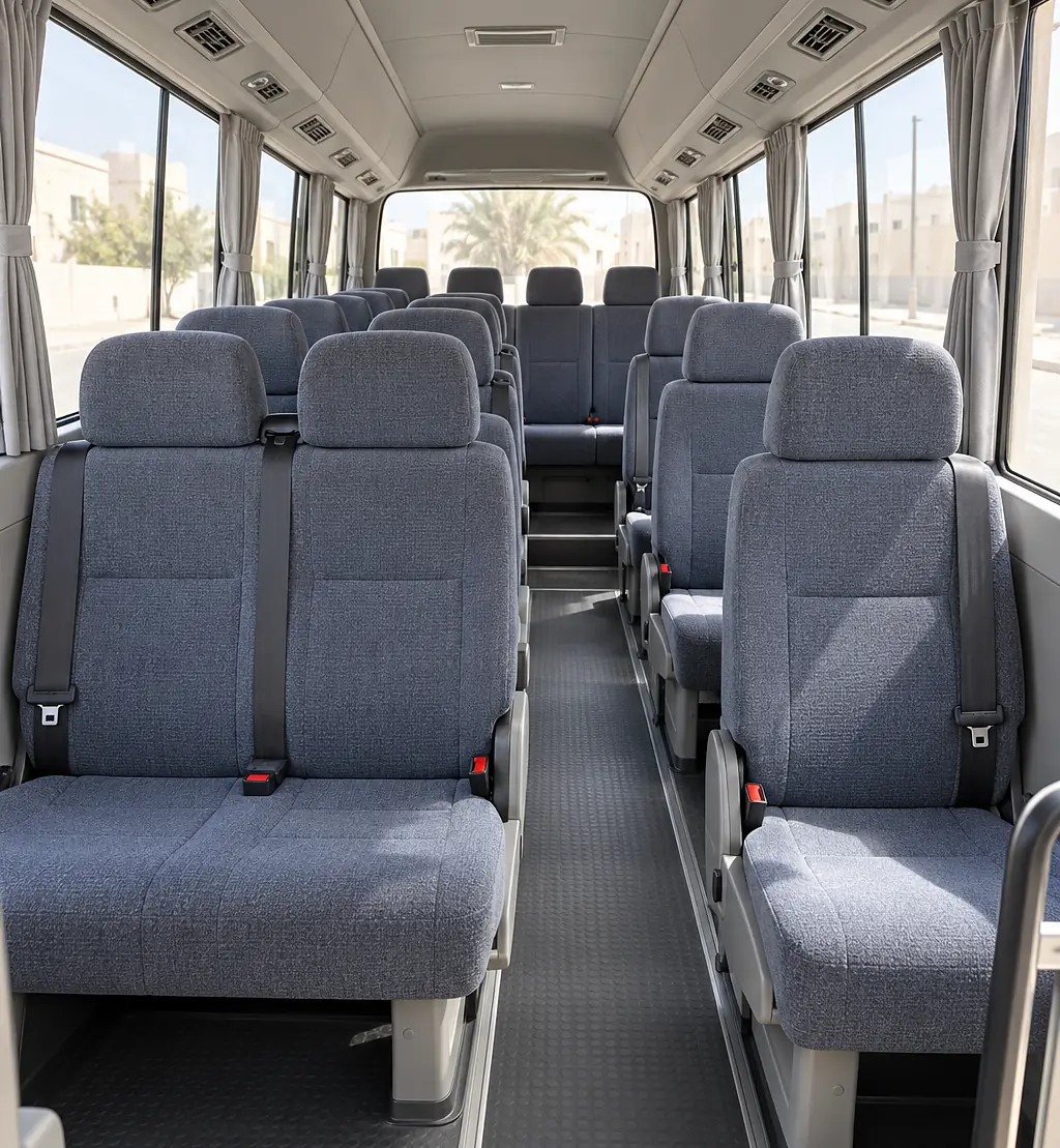 Inside the Toyota Coaster: seats and luggage space for Umrah pilgrims